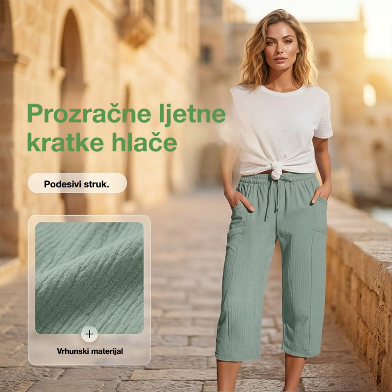 🌺【Kupi 1, dobi 1 gratis】👖Ženske jednobojne plisirane capri hlače od pamuka i lana - hladne i prozračne, laskaju obliku nogu