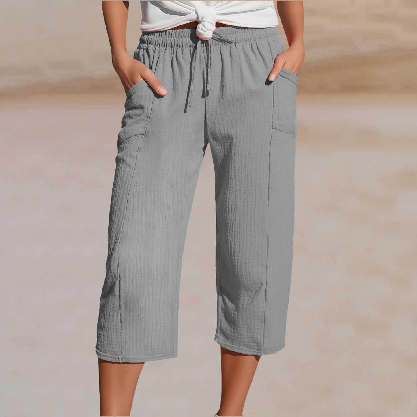 🌺【Kupi 1, dobi 1 gratis】👖Ženske jednobojne plisirane capri hlače od pamuka i lana - hladne i prozračne, laskaju obliku nogu
